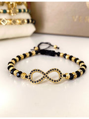 Bratara onix fatetat pe globuri si inox aurit, model infinit